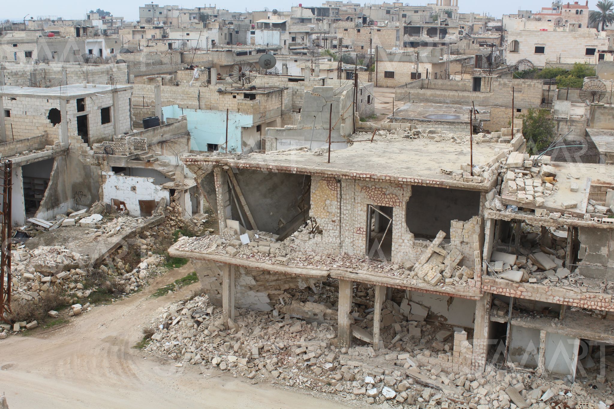 مشروع إعادة الإعمار لمدينتي (كفرزيتا، واللطامنة) في ريف حماة الشمالي الخاليتين من السكان، والذي أطلقه محافظ حماة (محمد كريشاتي) وروَّج له إعلام نظام الأسد